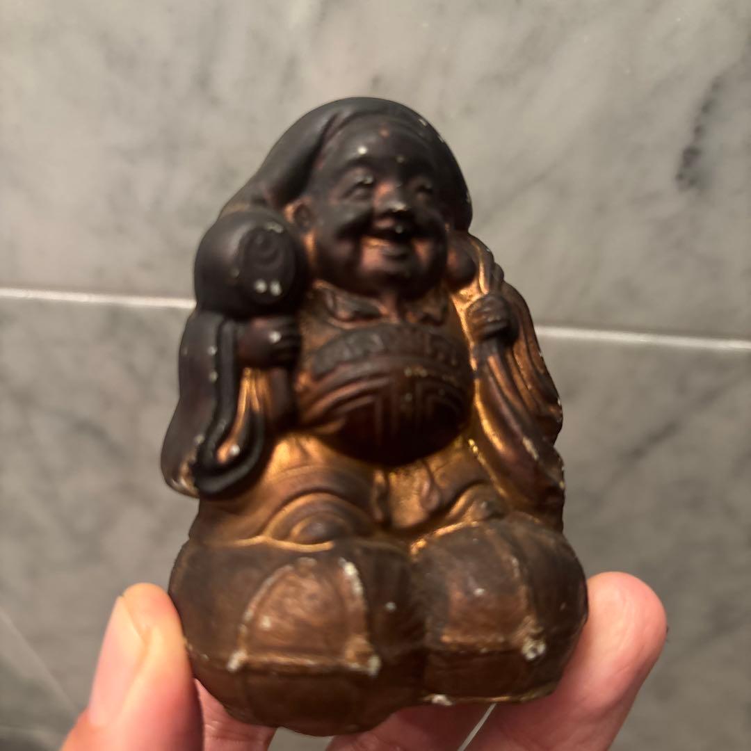 アンティーク明治時代平和的なお顔で 笑顔が素敵な大黒様の陶器オブジェ