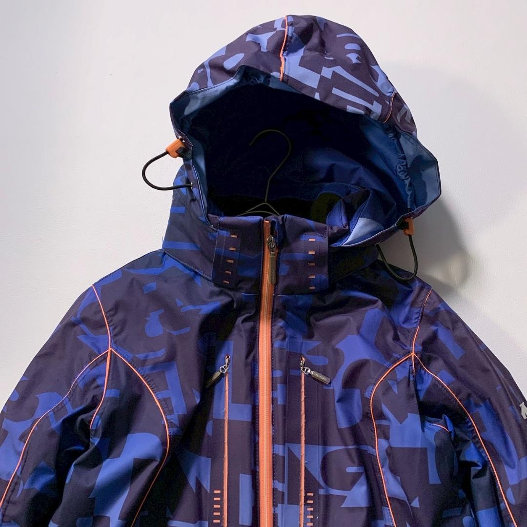【高機能】デサント スキージャケット モーション3D ヒートナビ 総柄 青 M