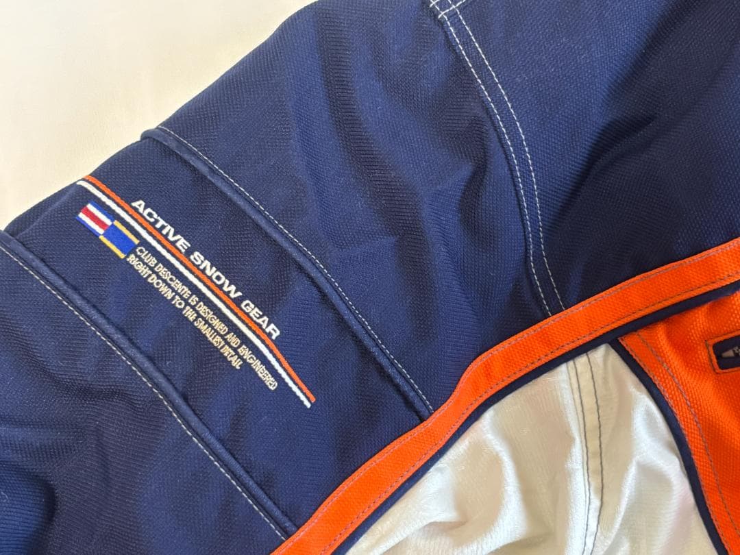 DESCENTEデサント スキースノーボードウェア オレンジ/ネイビー サイズO