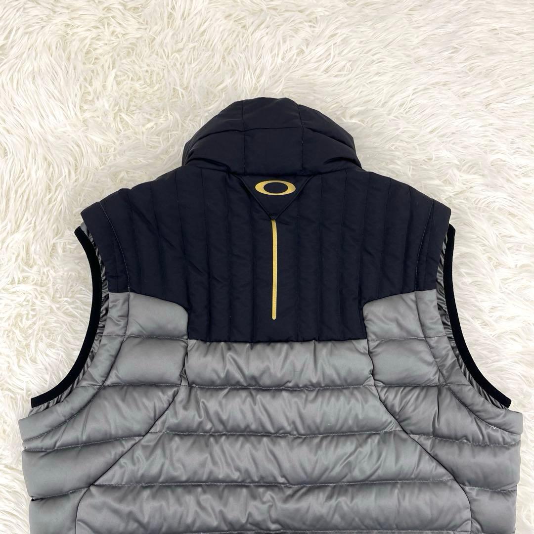 【美品】オークリー・ゴルフウェア・ダウンベスト・アシンメトリー・ロゴプリント・M