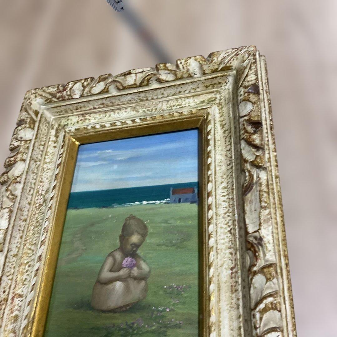 海辺の少女の油彩画