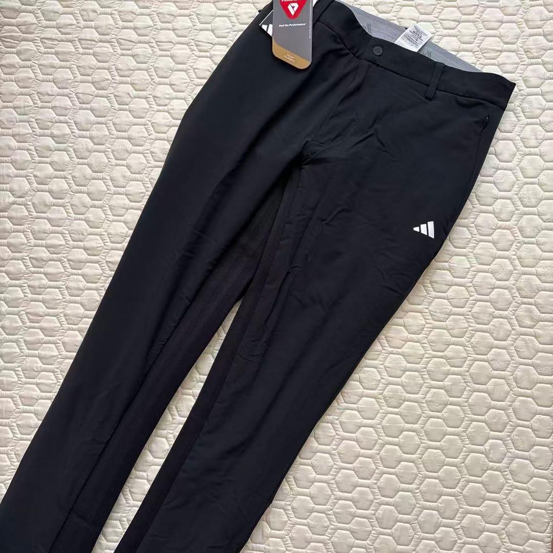 85新品27500円アディダスゴルフ/メンズ/秋冬/中綿ストレッチパンツ/黒