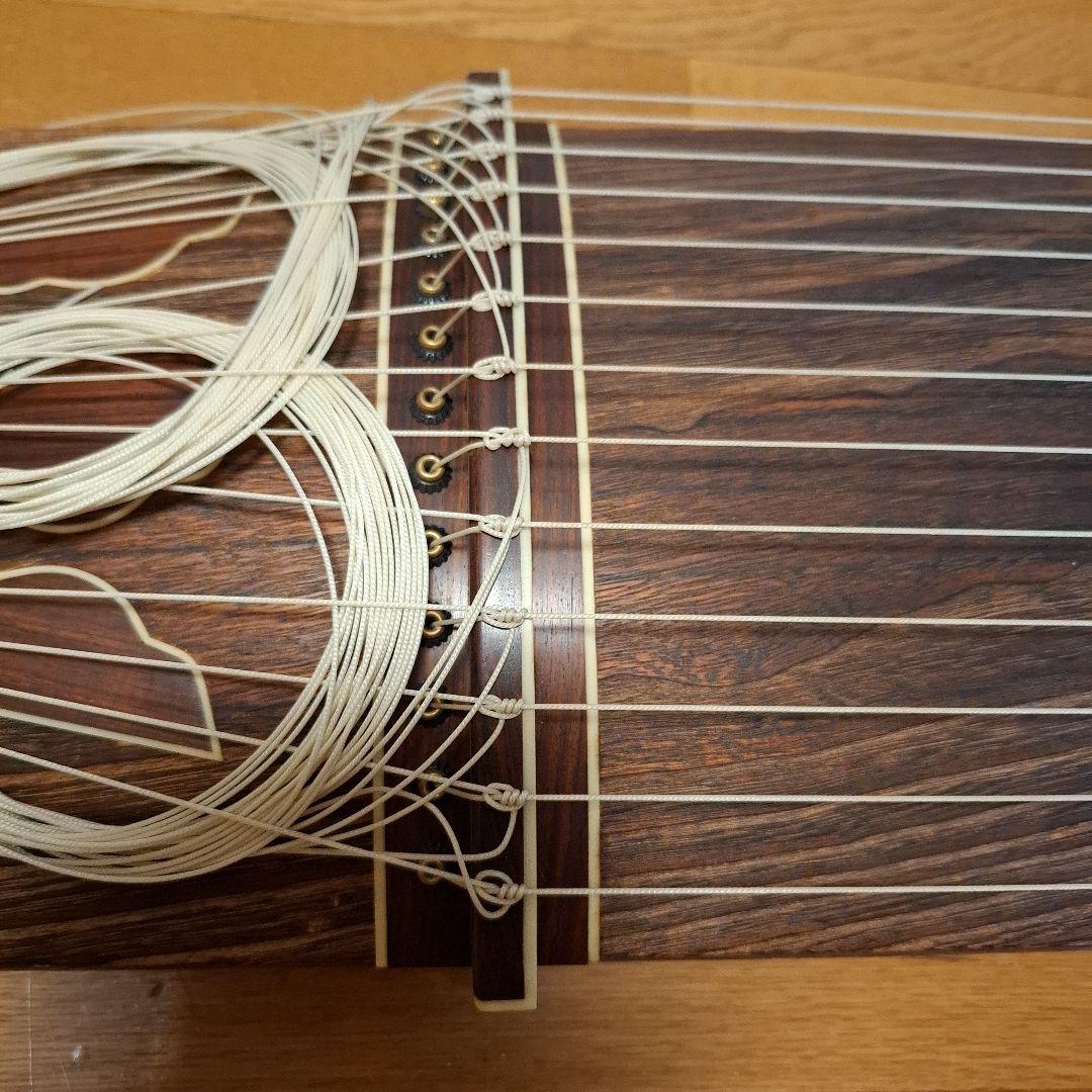 オレンジ色の鶴模様の袋つき　　　お琴