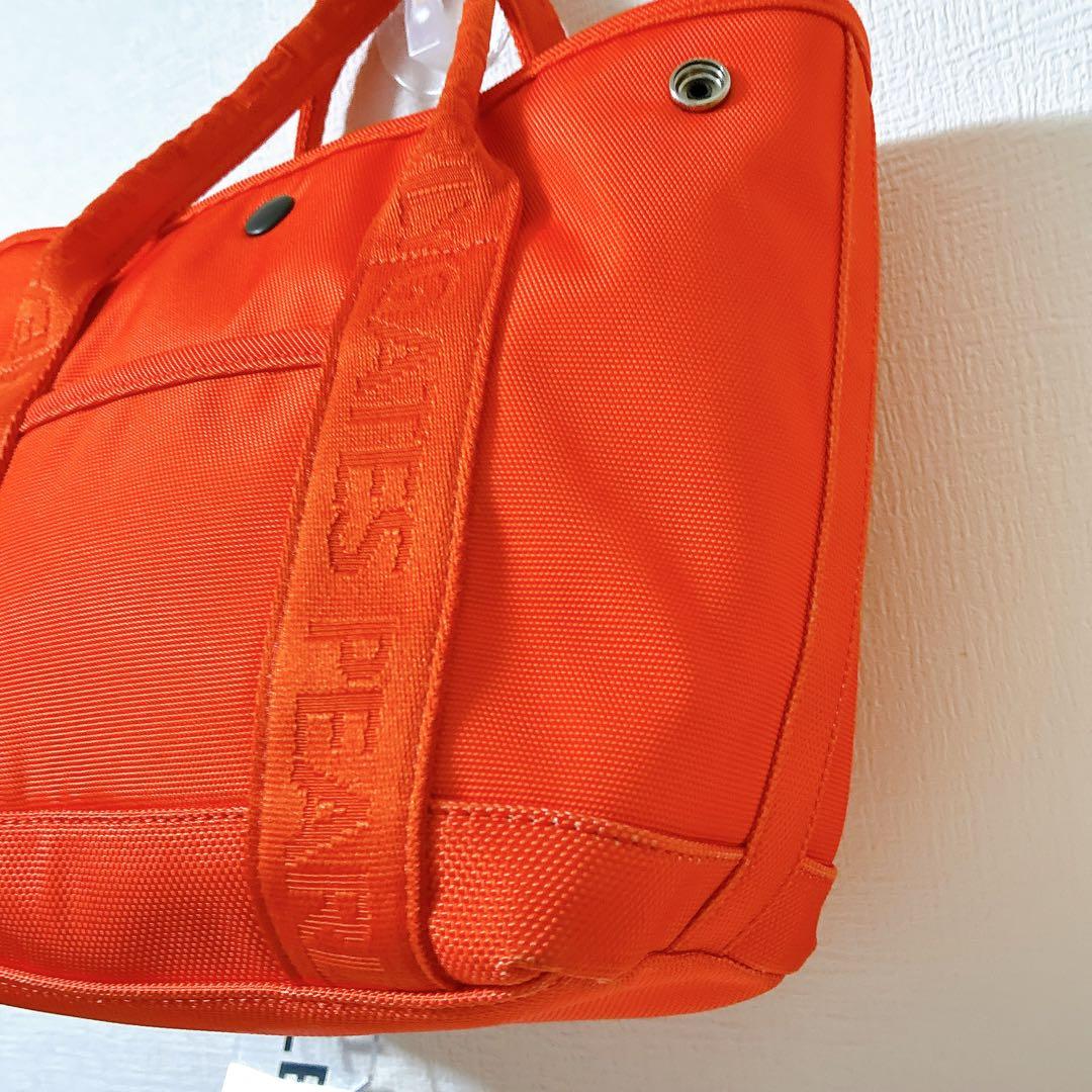 極美品 パーリーゲイツ ゴルフバッグ オレンジ ロゴチャーム付きカートバッグ