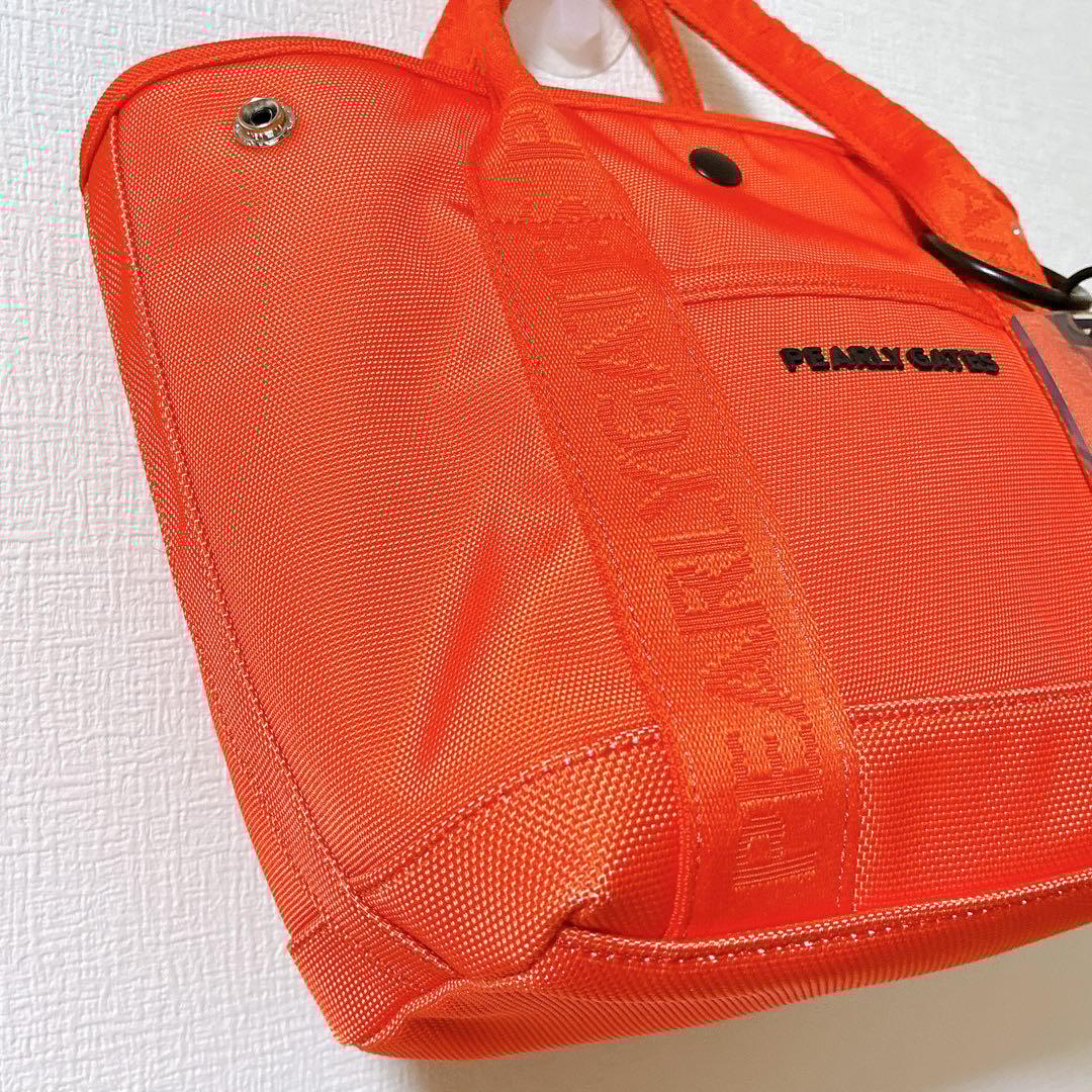 極美品 パーリーゲイツ ゴルフバッグ オレンジ ロゴチャーム付きカートバッグ