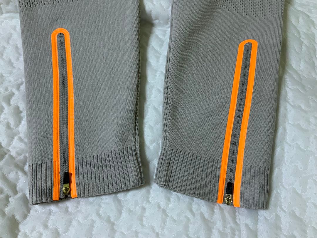 マークアンドロナレディースパンツ オレンジジッパー