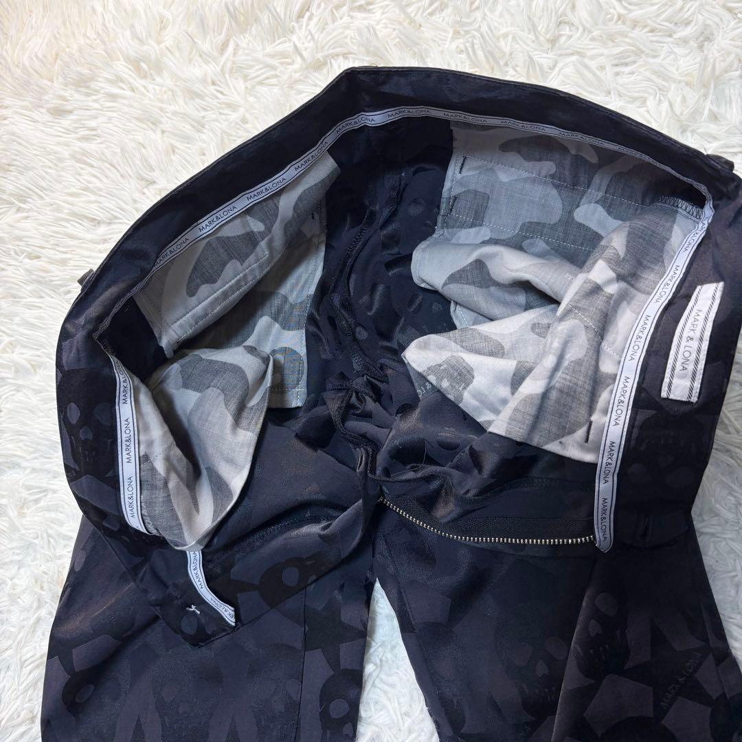 マークアンドロナ パンツ 総柄 スカル