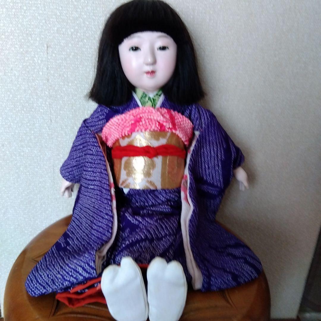 市松人形 微笑み 緑色の衣装