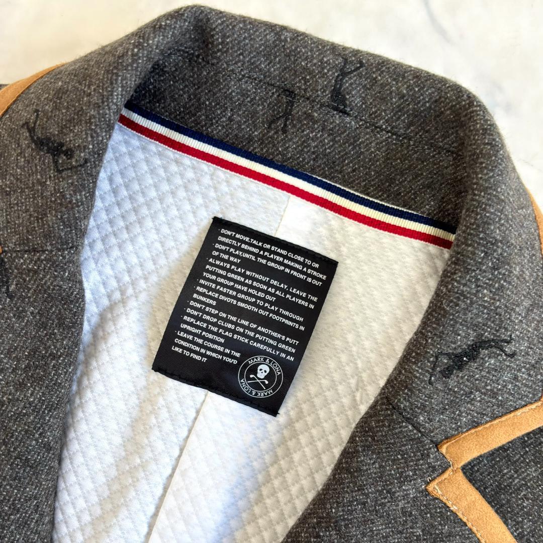 マークアンドロナ ジャケット 刺繡ロゴ パイピング 金ボタン グレー tw5