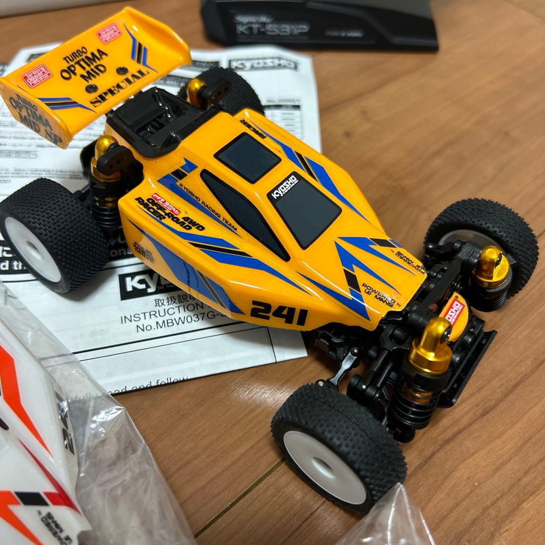 タカクワツトム