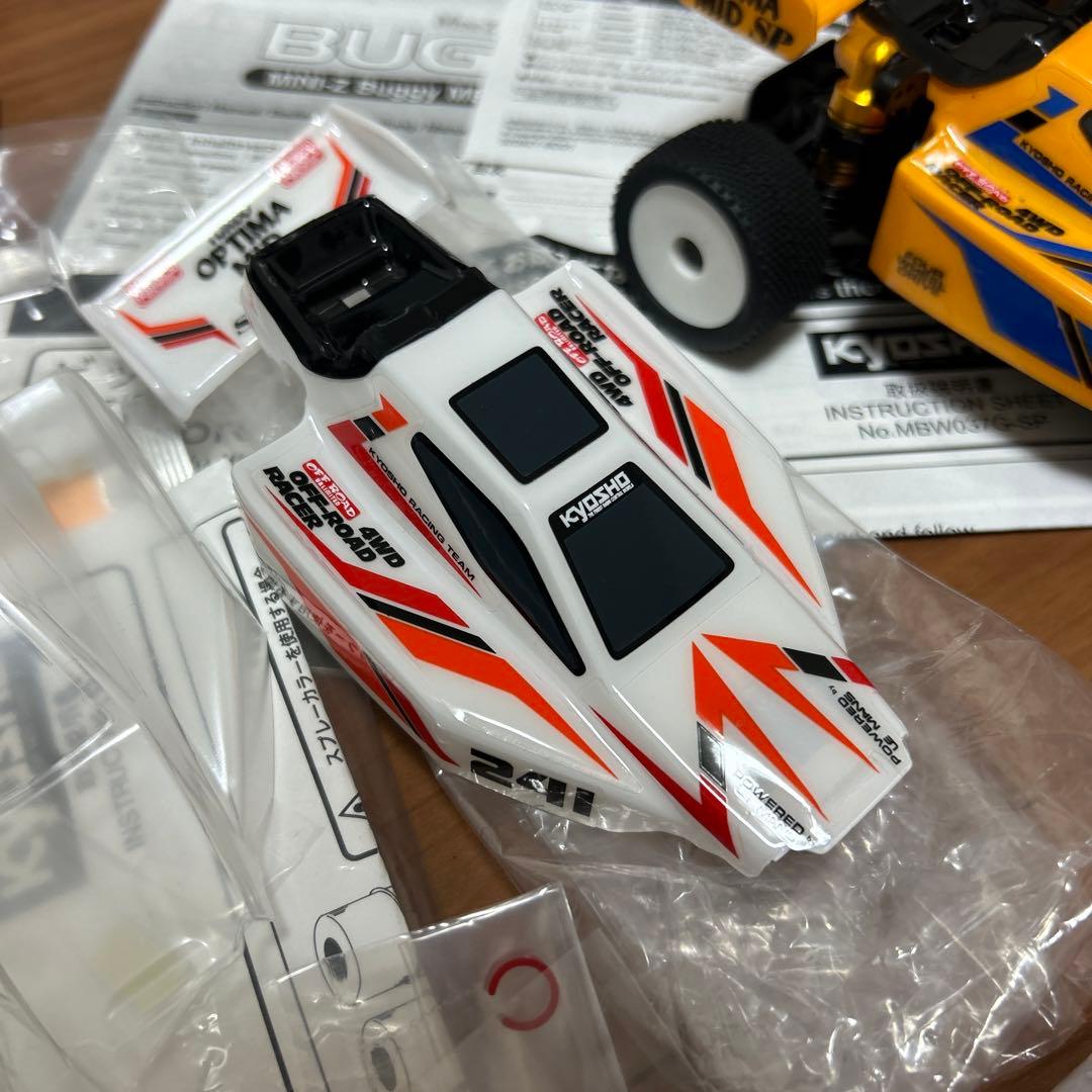 タカクワツトム