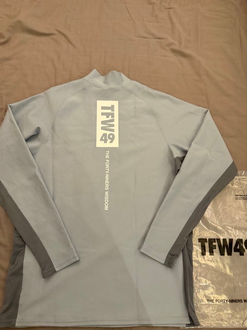 メンズウェア TFW49 LS MOCKNECK L.BLUE L