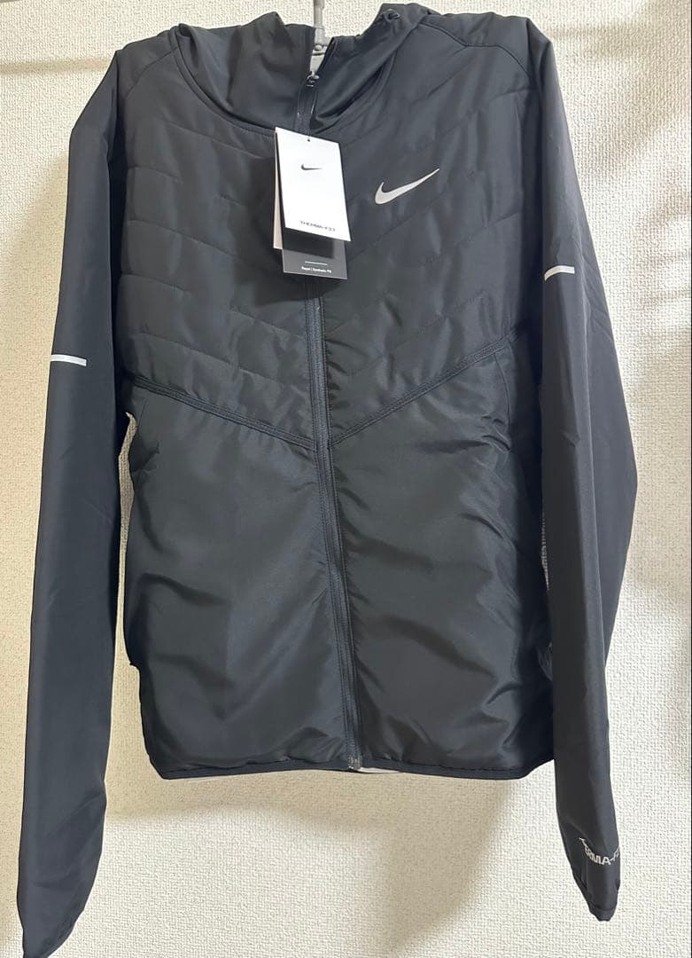新品NIKE Mサイズ ランニングジャケット中綿ジャケットメンズ