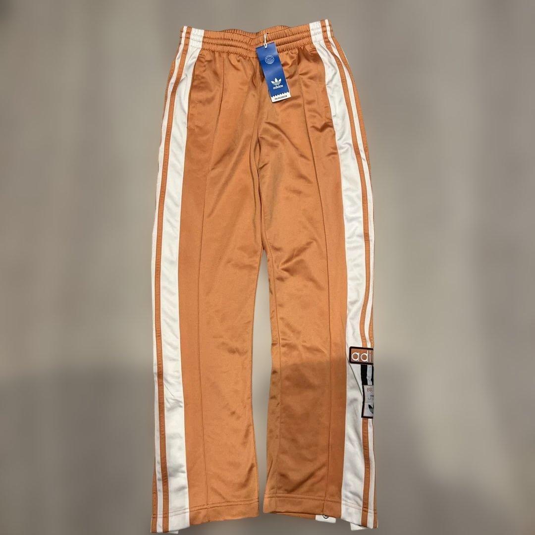 adidas トラックパンツ オレンジ